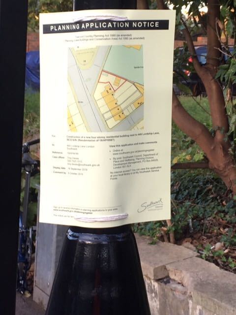 Planning application notice on a lamp post